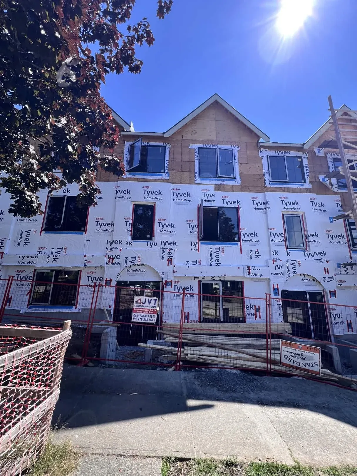 Three-storey framing with JVT signage